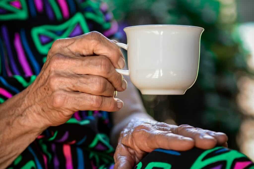 Older lady holding cup